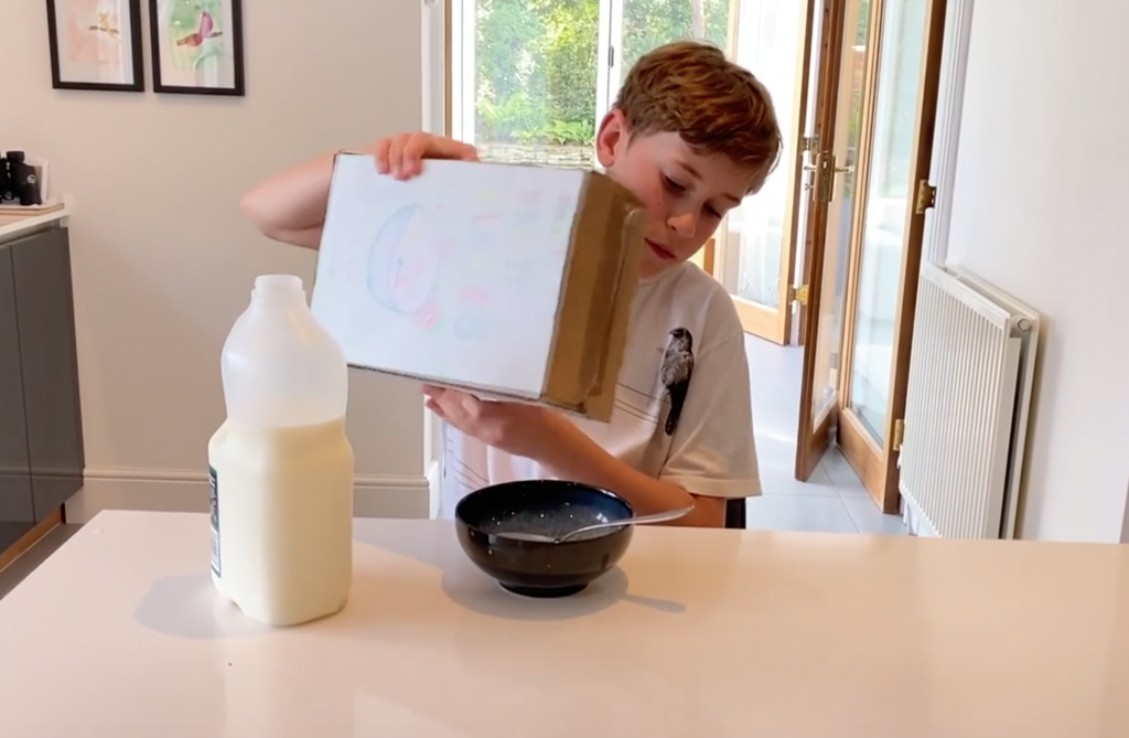 Boy pouring cereal