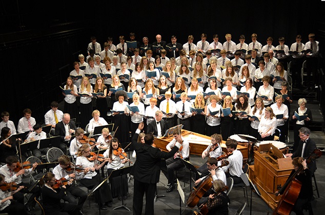 Choir singing and orchestra